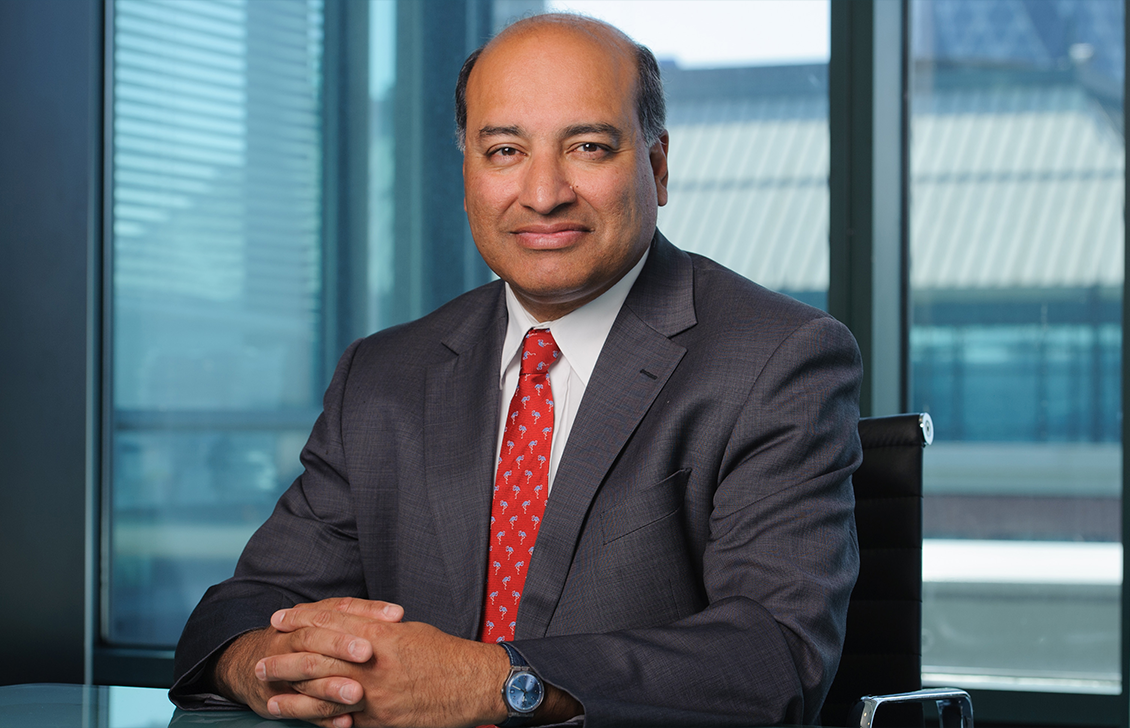 Sir Suma Chakrabarti at desk in EBRD office